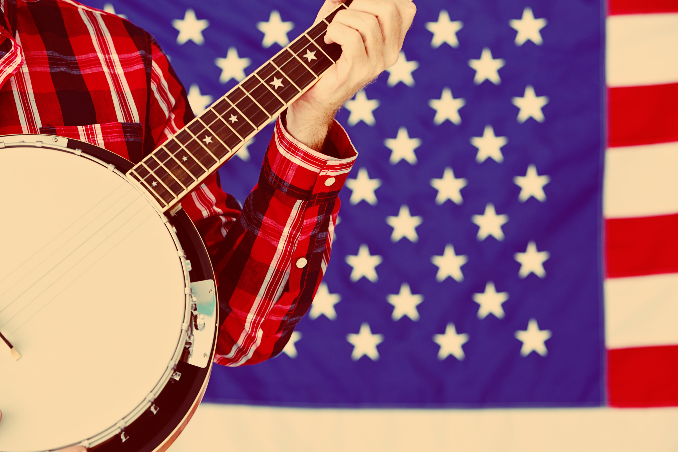American country music played on banjo by US national flag